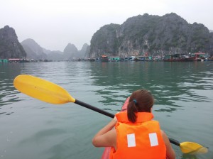 Nicole Paddling Toward Floating Village